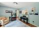 Inviting sitting room with piano, bar, and comfortable seating for relaxing or entertaining at 10 Skyeman Dr, Charleston, SC 29414
