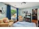 Relaxing sitting room with comfortable seating, wet bar, and peaceful backyard views at 10 Skyeman Dr, Charleston, SC 29414