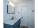 Modern bathroom featuring a sleek vanity with a rectangular mirror and modern fixtures at 100 Colonial Dr, Goose Creek, SC 29445