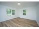 Bright bedroom with wood floors, crown molding, and plenty of natural light at 100 Colonial Dr, Goose Creek, SC 29445
