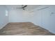 Spacious bedroom featuring hardwood floors, a ceiling fan, and double closets at 100 Colonial Dr, Goose Creek, SC 29445