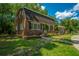 A well-maintained brick home with lush greenery and a welcoming entrance at 100 Colonial Dr, Goose Creek, SC 29445