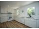 Updated kitchen featuring white cabinets, countertops, and stainless steel appliances at 100 Colonial Dr, Goose Creek, SC 29445