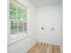 Laundry room with hookups, light walls and floors, and a view of the outside at 100 Colonial Dr, Goose Creek, SC 29445