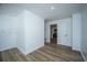 Neutral room provides a doorway view into the newly renovated kitchen at 100 Colonial Dr, Goose Creek, SC 29445