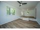 Inviting living room with natural light, wood floors, and elevated platform at 100 Colonial Dr, Goose Creek, SC 29445