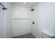 Walk-in shower with white subway tile and a contrasting black-and-white mosaic floor at 100 Colonial Dr, Goose Creek, SC 29445