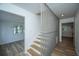 Bright foyer featuring a staircase with modern railing and wood floors at 100 Colonial Dr, Goose Creek, SC 29445
