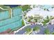 Aerial view shows tennis courts and recreation areas near the clubhouse of this planned community at 1013 Sagegrass St, Summerville, SC 29485