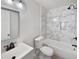 Modern bathroom with a sleek vanity, tiled shower-tub combo, and contemporary fixtures for a spa-like experience at 102 Rebellion Rd, Summerville, SC 29483
