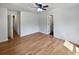 Spacious bedroom with hardwood flooring, ceiling fan, and neutral wall color at 102 Rebellion Rd, Summerville, SC 29483