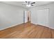 Bedroom featuring hardwood floors, ceiling fan, and double door closet at 102 Rebellion Rd, Summerville, SC 29483