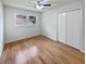 Bedroom with light hardwood floors, a ceiling fan, and a window view at 102 Rebellion Rd, Summerville, SC 29483
