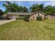 Charming brick home featuring a well-manicured lawn and a attached garage, creating a welcoming curb appeal at 102 Rebellion Rd, Summerville, SC 29483