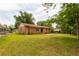 Large backyard showcasing the brick house and ample green space at 104 Belmont Ct, Ladson, SC 29456
