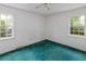 Bedroom features two windows that bring in natural light and is equipped with a ceiling fan at 104 Belmont Ct, Ladson, SC 29456