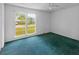 Bedroom with a large window overlooking the front yard and ceiling fan in the center of the room at 104 Belmont Ct, Ladson, SC 29456