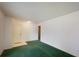 Bedroom showing an entrance to another room and green carpeted flooring throughout the space at 104 Belmont Ct, Ladson, SC 29456