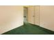 Bedroom showing green carpet, door, and light switches on the wall at 104 Belmont Ct, Ladson, SC 29456