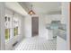 Kitchen with white cabinetry, laminate countertops, and black and white patterned tile floor at 104 Belmont Ct, Ladson, SC 29456