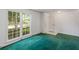 Open floor plan with large windows providing ample natural light and views of the front yard at 104 Belmont Ct, Ladson, SC 29456