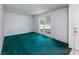Empty room with plush carpeting, white walls, and natural light from the window at 104 Belmont Ct, Ladson, SC 29456