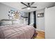 This bedroom has gray walls, wood floors, a large bed, and a window providing natural light at 104 Greensboro Ln, Ladson, SC 29456