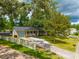 Well-maintained single-story house with a manicured lawn and a classic white picket fence at 104 Greensboro Ln, Ladson, SC 29456