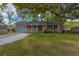 Charming single-story home with a welcoming front porch and a lush, well-manicured lawn at 104 Greensboro Ln, Ladson, SC 29456