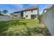 Large grass backyard with newly constructed fence and screened in porch at 1059 Sago Palm Ct, Mount Pleasant, SC 29429