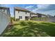 Expansive backyard with lush green lawn and a privacy fence, perfect for outdoor activities at 1059 Sago Palm Ct, Mount Pleasant, SC 29429