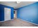 Bedroom featuring blue walls, plush carpet, and a starry night ceiling light at 1059 Sago Palm Ct, Mount Pleasant, SC 29429