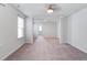 Open bedroom featuring plush carpeting, natural light, and neutral paint scheme at 1059 Sago Palm Ct, Mount Pleasant, SC 29429