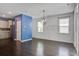 Dining area with modern chandelier, hardwood floors, and access to kitchen at 1059 Sago Palm Ct, Mount Pleasant, SC 29429