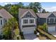 Beautiful two-story home featuring a neutral color scheme, attached two-car garage, and manicured landscaping at 1059 Sago Palm Ct, Mount Pleasant, SC 29429