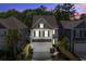 Charming two-story home with manicured landscaping and inviting curb appeal at dusk at 1059 Sago Palm Ct, Mount Pleasant, SC 29429