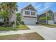 Well-maintained two-story home with a manicured lawn and convenient two-car garage at 1059 Sago Palm Ct, Mount Pleasant, SC 29429