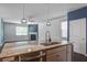 Kitchen island featuring stainless steel sink, pendant lights, and granite countertops at 1059 Sago Palm Ct, Mount Pleasant, SC 29429