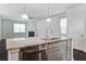 Modern kitchen with stainless steel appliances and granite countertops, open to the living area at 1059 Sago Palm Ct, Mount Pleasant, SC 29429