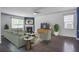 Inviting living room with a fireplace, neutral paint, stylish furniture, and natural light at 1059 Sago Palm Ct, Mount Pleasant, SC 29429