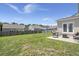 The backyard features a large lawn, a fence, and a patio with outdoor furniture at 110 Levis Song Ct, Goose Creek, SC 29445