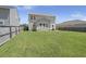 The backyard features a large lawn, a fence, and a patio with outdoor furniture at 110 Levis Song Ct, Goose Creek, SC 29445