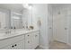 Bathroom featuring a double sink vanity, large mirror, and neutral color palette at 110 Levis Song Ct, Goose Creek, SC 29445