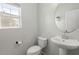 Stylish half-bathroom featuring a modern sink and toilet, perfect for guests at 110 Levis Song Ct, Goose Creek, SC 29445