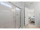 Bathroom featuring a glass shower and a doorway to the bedroom at 110 Levis Song Ct, Goose Creek, SC 29445