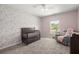 This Bedroom features charming floral wallpaper, a dark wood crib, and a cozy gray armchair at 110 Levis Song Ct, Goose Creek, SC 29445