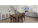 Cozy dining area with wood table and chairs, open to the living space at 110 Levis Song Ct, Goose Creek, SC 29445