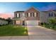 Charming two-story home with a brick facade, well-manicured lawn, and inviting front porch at 110 Levis Song Ct, Goose Creek, SC 29445