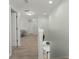 Hallway featuring wood floors and neutral paint tones leading to the living space at 110 Levis Song Ct, Goose Creek, SC 29445
