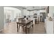 Charming kitchen and dining area with white cabinets, stainless steel appliances, and stylish pendant lighting at 110 Levis Song Ct, Goose Creek, SC 29445